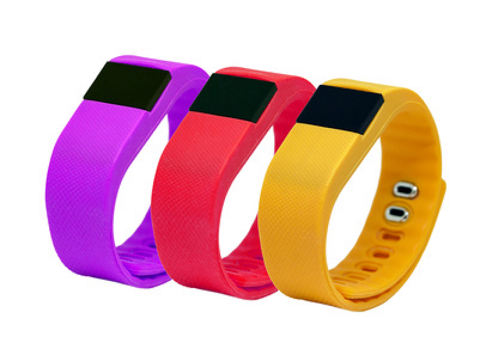 3 brightly colored Fitbits