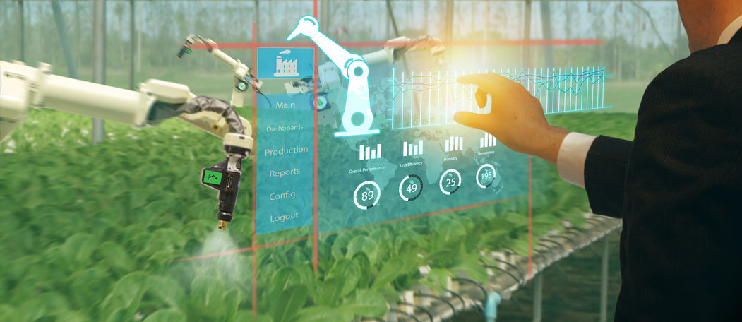 iot smart industry robot 4.0 agriculture concept,agronomist,farmer(blurred) using smart glasses (augmented mixed virtual reality,artificial intelligence technology) to monitoring autonomous robotics