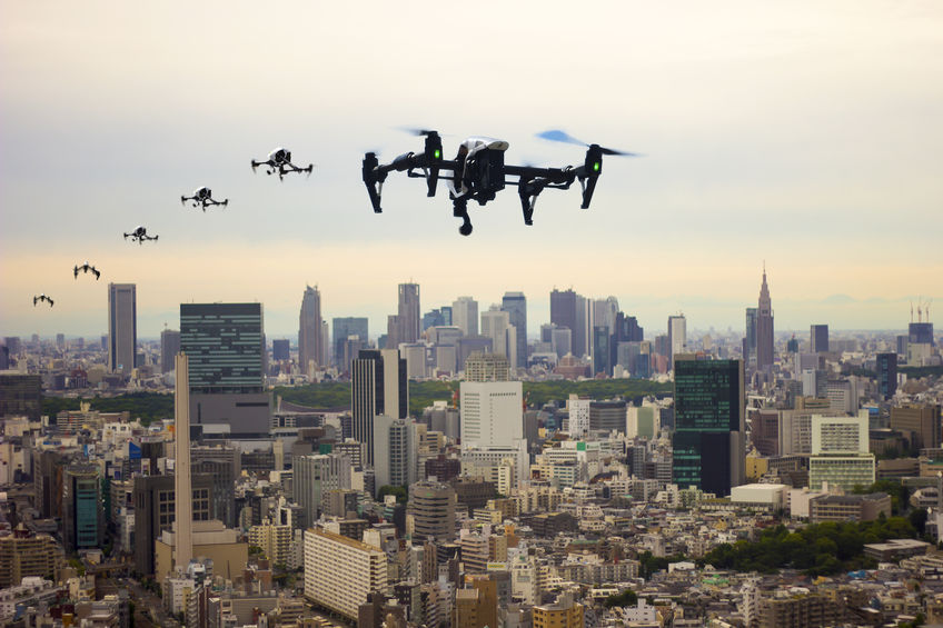 Drones flying across a city