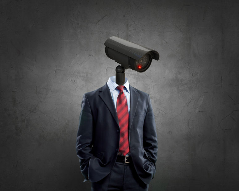 Portrait of camera headed man in suit as security concept