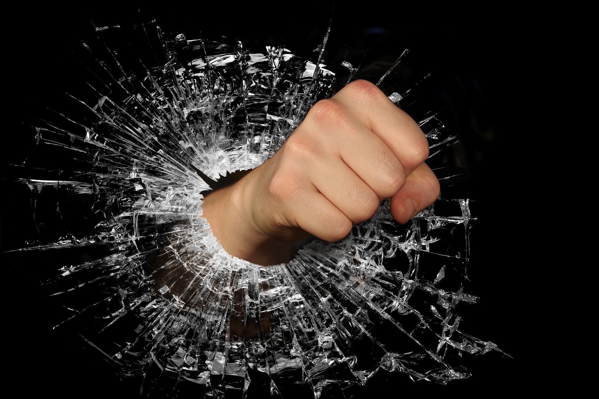 Fist punching through glass