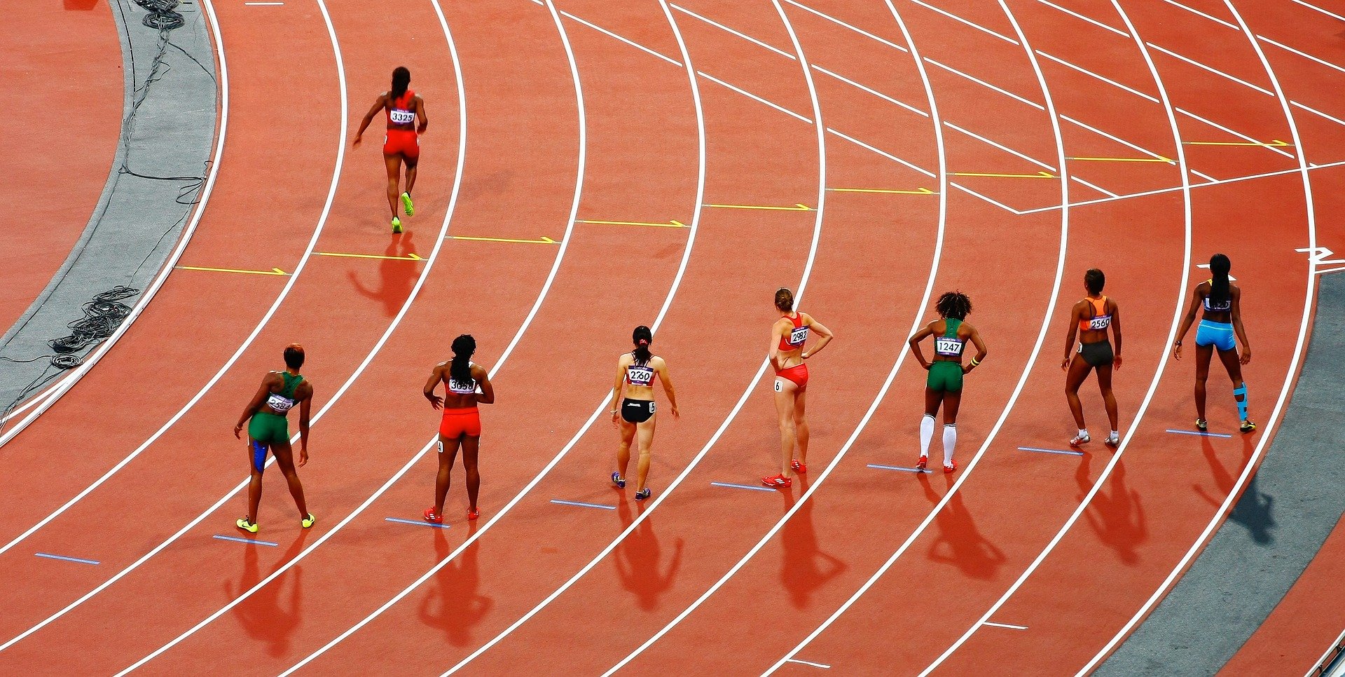 Women running a race on a track