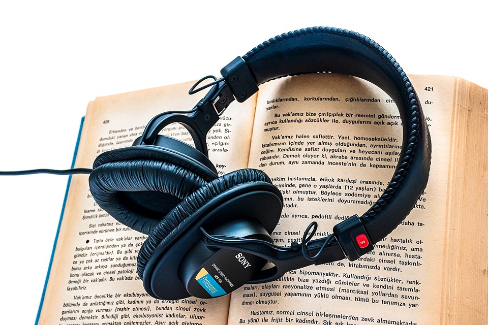 Headphones on open book